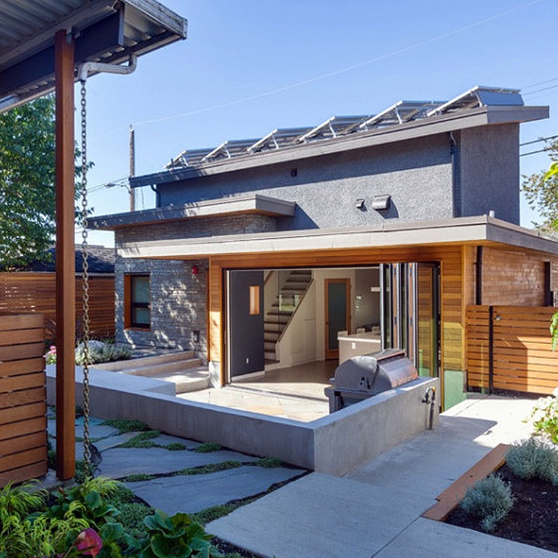 A concrete backyard of a single-family home.